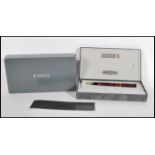 A boxed Parker, Duofold Centennial, maroon marbled fountain pen, the cap with gilt arrow clip and