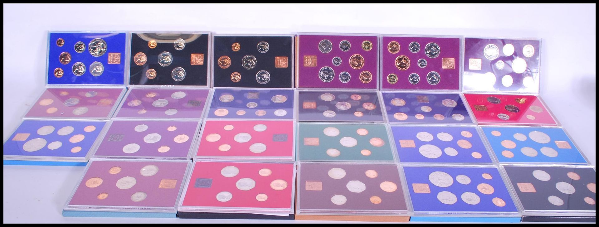 A collection of Royal Mint Coinage of Great Britain and Ireland commemorative annual coin sets to