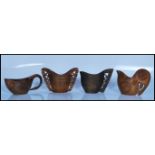 A group of four 20th century Scandinavian treen woodwork Arts and Crafts drinking cups, having