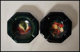 Two early part of the 20th Century W. Moorcroft ashtrays of octagonal form one in the Freesia