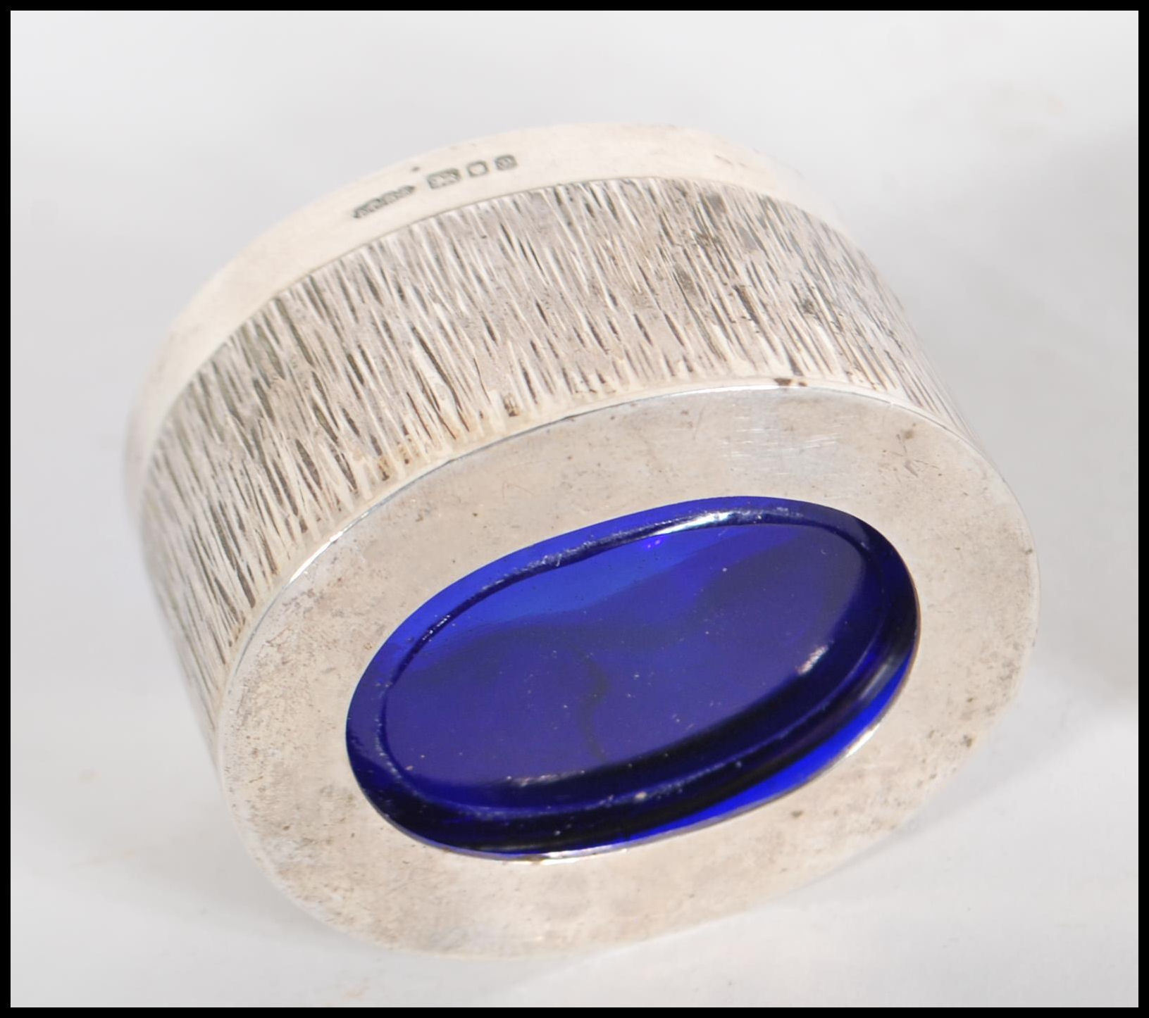 Two silver hallmarked table salts having bark effect decoration and blue glass liners, together with - Image 4 of 5
