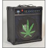 A Custom Sound guitar amplifier model no. CS100B in black, with a leaf painted to the front.