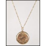 A stamped 9ct gold locket of round form engraved with a bird and florals on a stamped 375 9ct gold