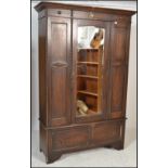 A 1920's oak single wardrobe in the Arts & Crafts style. Raised on bracket feet with single drawer