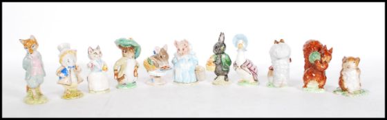 A collection of eleven Beswick ceramic Beatrix Potter figurines to include Jemina Puddleduck, Little