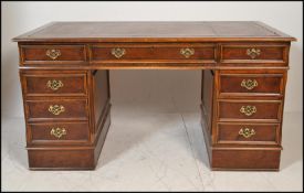 A Victorian style large mahogany partners desk. Each pedestal raised on a plinth base with a