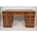 A Victorian style large mahogany partners desk. Each pedestal raised on a plinth base with a