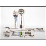 A collection of 20th Century kitchenalia to include a stamped 800 silver ladle with floral garland