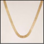 A hallmarked 9ct gold mesh chain necklace having a lobster clasp. Bearing import marks for 1986.