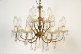 An antique style  six branch, twelve light gilt metal and cut glass chandelier - electrolier. The