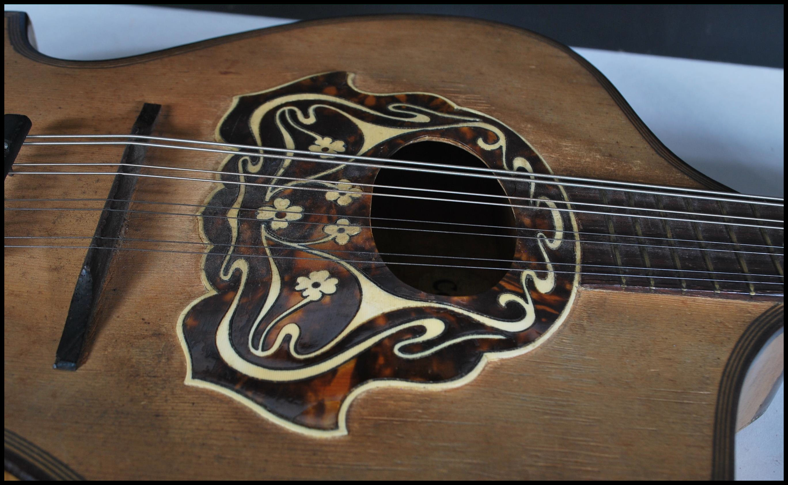 An early 20th Century Mandolin having mother of pearl inlaid fingerboard with bone and tortoiseshell - Image 5 of 7