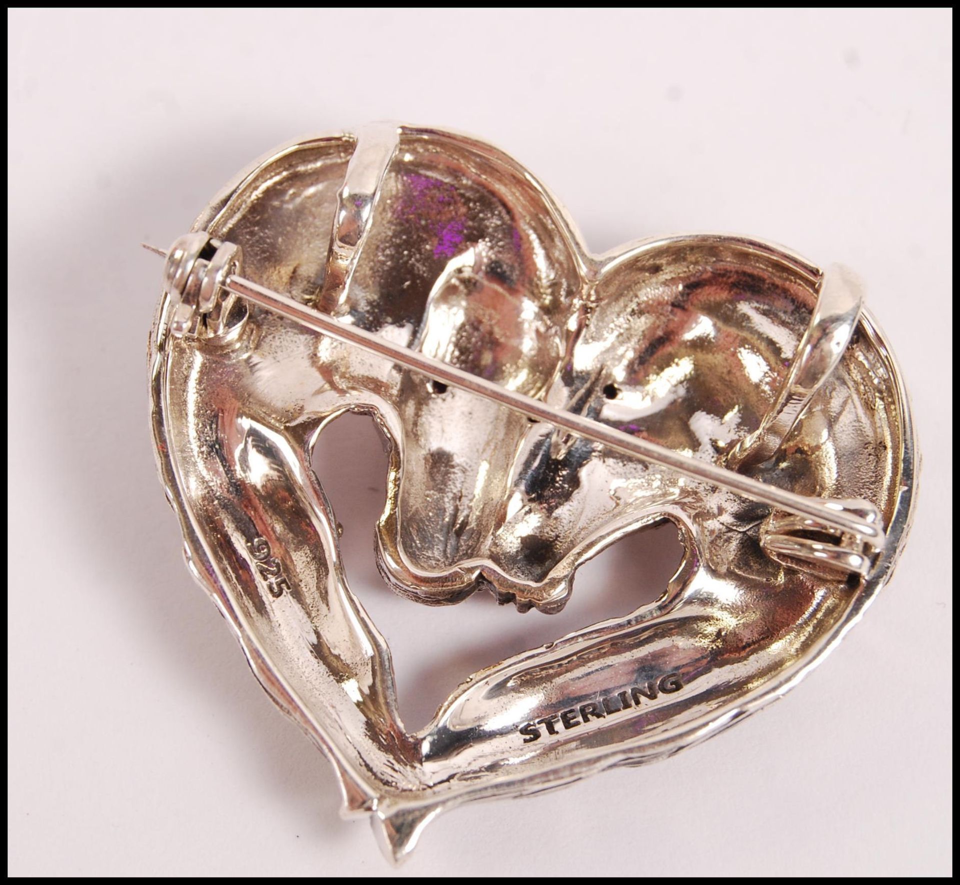 A stamped 925 silver heart shaped brooch in the form of two horses with red stone eyes. Weight 18. - Image 2 of 3