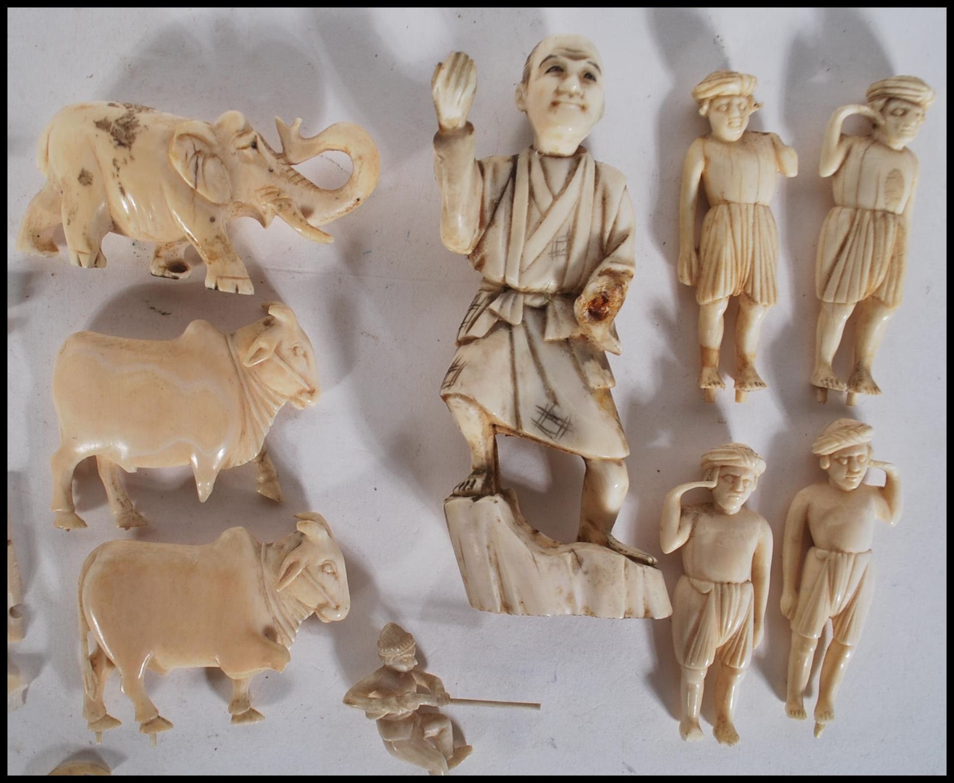 A group of late 19th Century carved ivory figurines to include Indian figures and animals - Image 12 of 12
