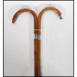 Two early 20th Century silver collared walking stick canes having crook handles. One made from