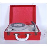 A vintage 20th Century circa 1960's portable record player in the form of a suitcase, lift up top