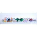 A good collection of 20th Century glass paperweights to include various controlled bubble and