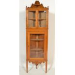 A 20th century Chestnut corner display cabinet, the upper section having twin glazed doors with