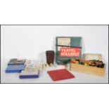 A collection of vintage 20th Century board games and card games to include a chess set, travel