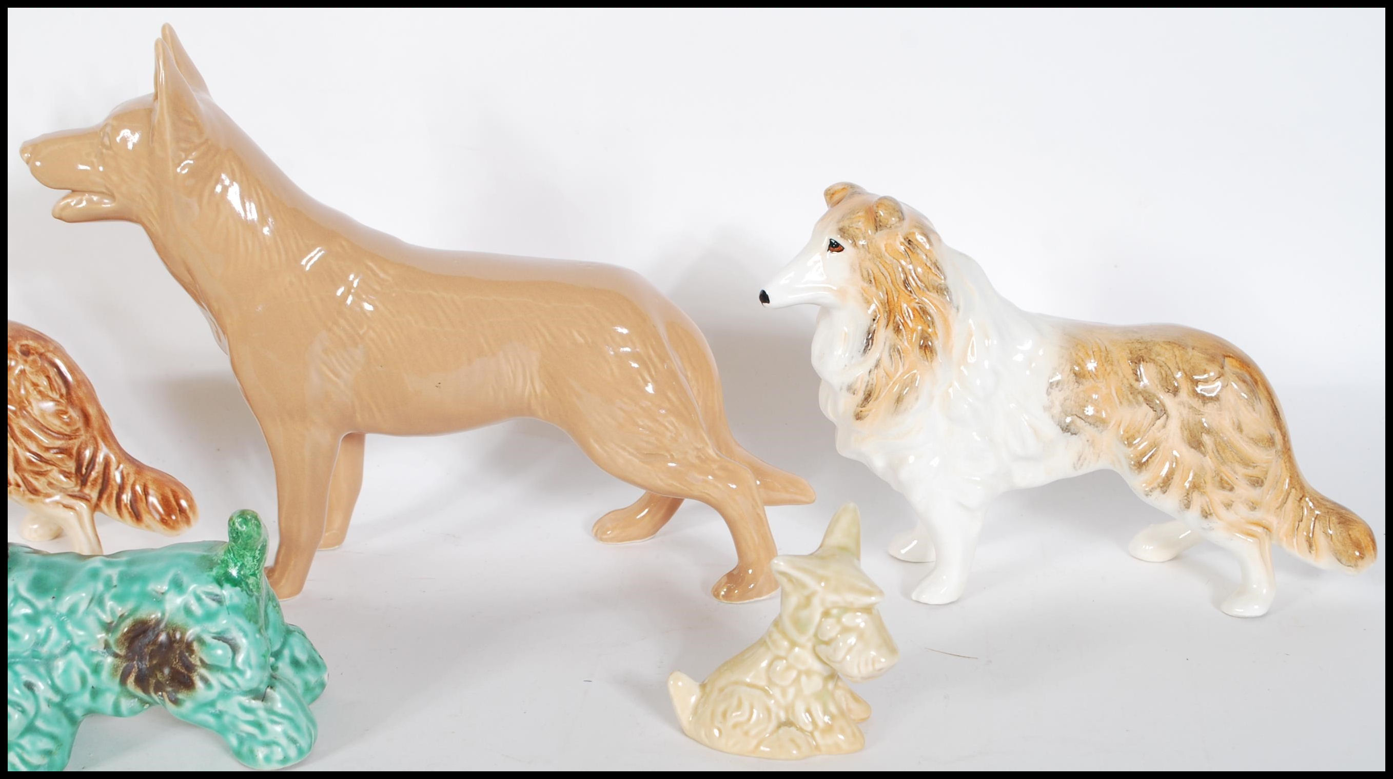 A collection of vintage 20th Century ceramic dog figurines by Sylvac to include a 1930's Terrier - Image 7 of 7