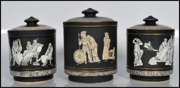 A set of 3 late 19th century pratt ware / Fenton of Pratt ' Old Greek ' pattern tobacco jars. Each