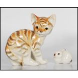 A 20th century Russian porcelain figurine of a kitten together with a small Russian figure of a