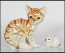 A 20th century Russian porcelain figurine of a kitten together with a small Russian figure of a