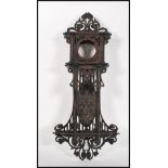 A early 20th Century Edwardian Black Forest style mahogany wall hanging clock case, having fret