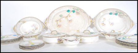 A Susie Cooper for Gray’s Pottery dinner service comprising dinner plates, tureens with ladles,