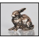 A 20th Century silver hallmarked figure in the form of a rabbit. Hallmarkes to base for London