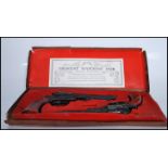 A vintage matching pair of Crescent Toys replica Texan Pistols finished in black having foliate