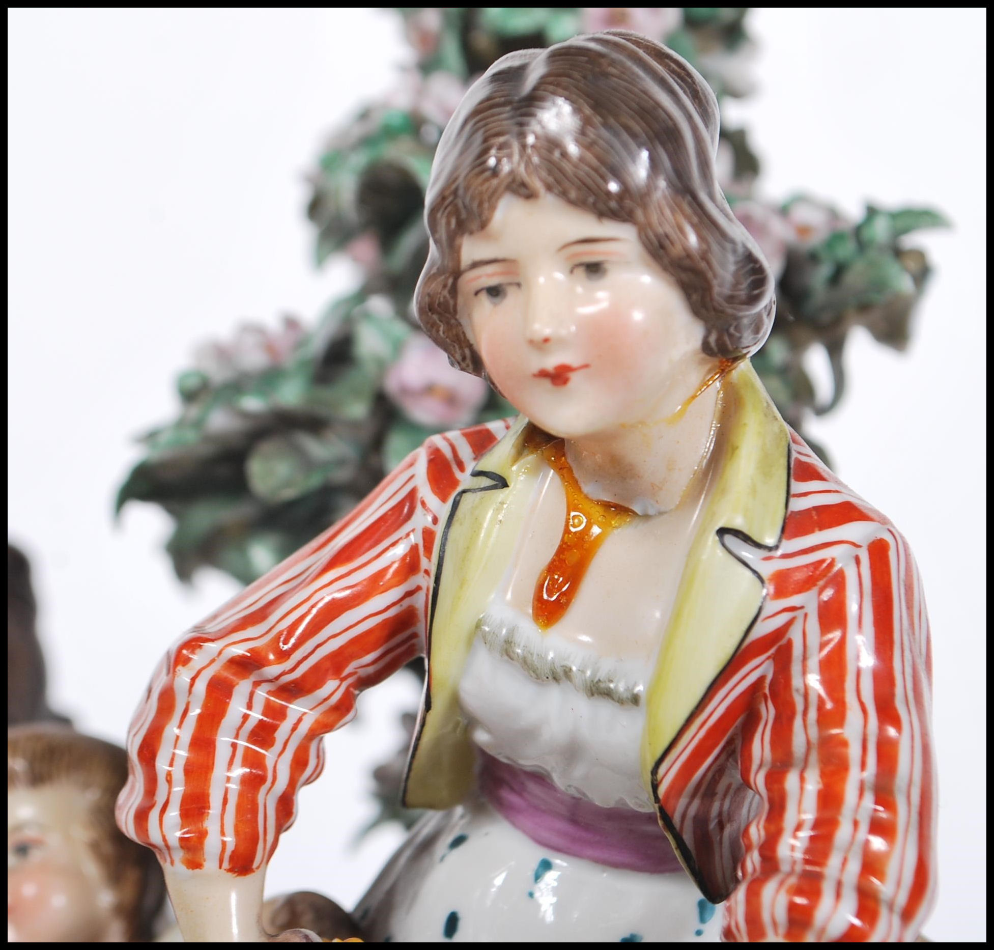 A late 19th Century Continental ceramic figurine group in the manner of Meissen. The group - Image 9 of 9