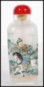 A 19th Century Chinese glass scent bottle with interior painted decoration depicting warriors on
