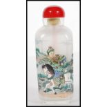 A 19th Century Chinese glass scent bottle with interior painted decoration depicting warriors on