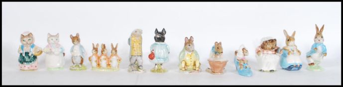 A collection of twelve Beswick Beatrix Potter ceramic figurines to include Peter Rabbit, Samuel