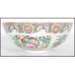 A early 20th Century Chinese famille rose bowl having hand painted floral sprays and madelons.