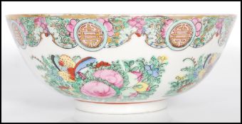 A early 20th Century Chinese famille rose bowl having hand painted floral sprays and madelons.