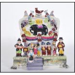 A ceramic Staffordshire porcelain diorama figure group of Wombwells Menagerie after the original