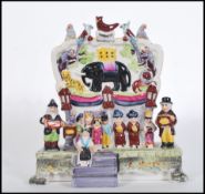 A ceramic Staffordshire porcelain diorama figure group of Wombwells Menagerie after the original