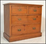A Victorian 19th century walnut cottage chest of drawers. Raised on a plinth base having 2 short