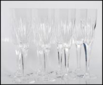 A set of eight 20th century Crystal cut glass champagne glasses, having a upper form with circular