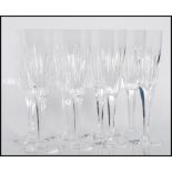 A set of eight 20th century Crystal cut glass champagne glasses, having a upper form with circular