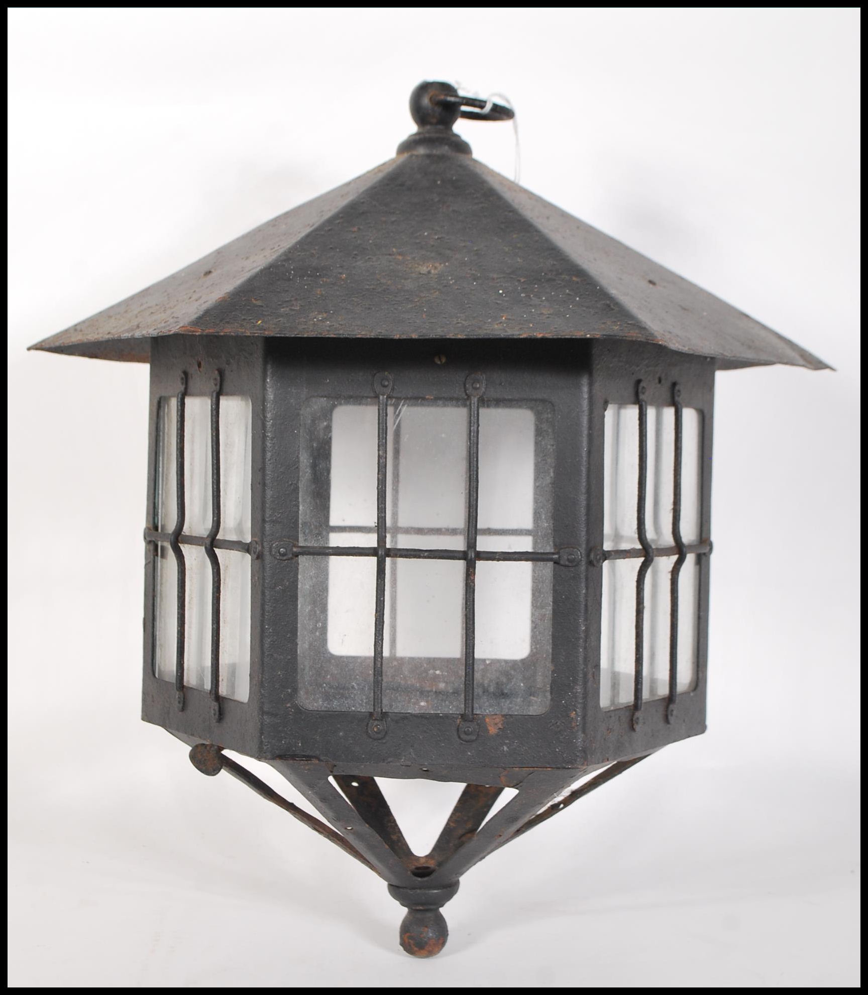 A late 19th Victorian / early 20th Century arts & crafts wrought iron lantern o f hexagonal form set