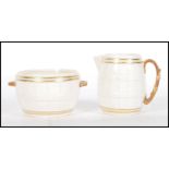 A 19th century Grainger & Co Royal China Co Worcester barrel shaped creamer and sugar bowl each with