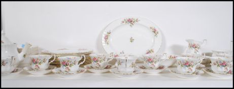 An extensive Royal Albert Moss Rose dinner / tea service to include plates, cups and saucers, tea