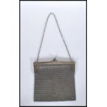 A 20th Century vintage silver mesh purse / bag having ball clasp to the top on a chain strap.
