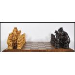 A 20th Century chess set having stylised resin animal kingdom character pieces, with the King and
