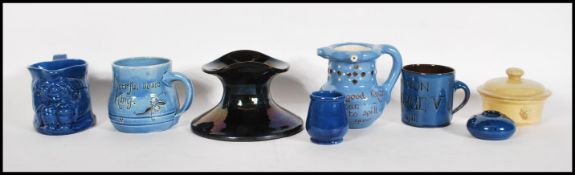 A collection of early 20th century CH Brannam Barum Ware to include a puzzle jug, mottowae mug,