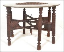A large 19th / 20th century Kashmir Binares table having a brass tray table top decorated with