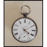 A silver hallmarked open face pocket watch dating from the late 19th century,  having white enamel