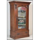 A Victorian 19th century wardrobe / armoire. Raised on a plinth base with single drawers. Above a